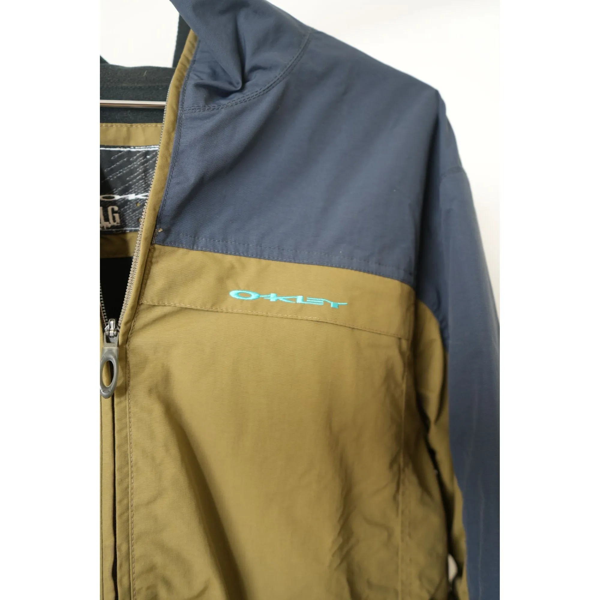 "Retail" Oakley 100% Nylon Full Zip Windbreaker Jacket Navy Blue/Brown Large Men's