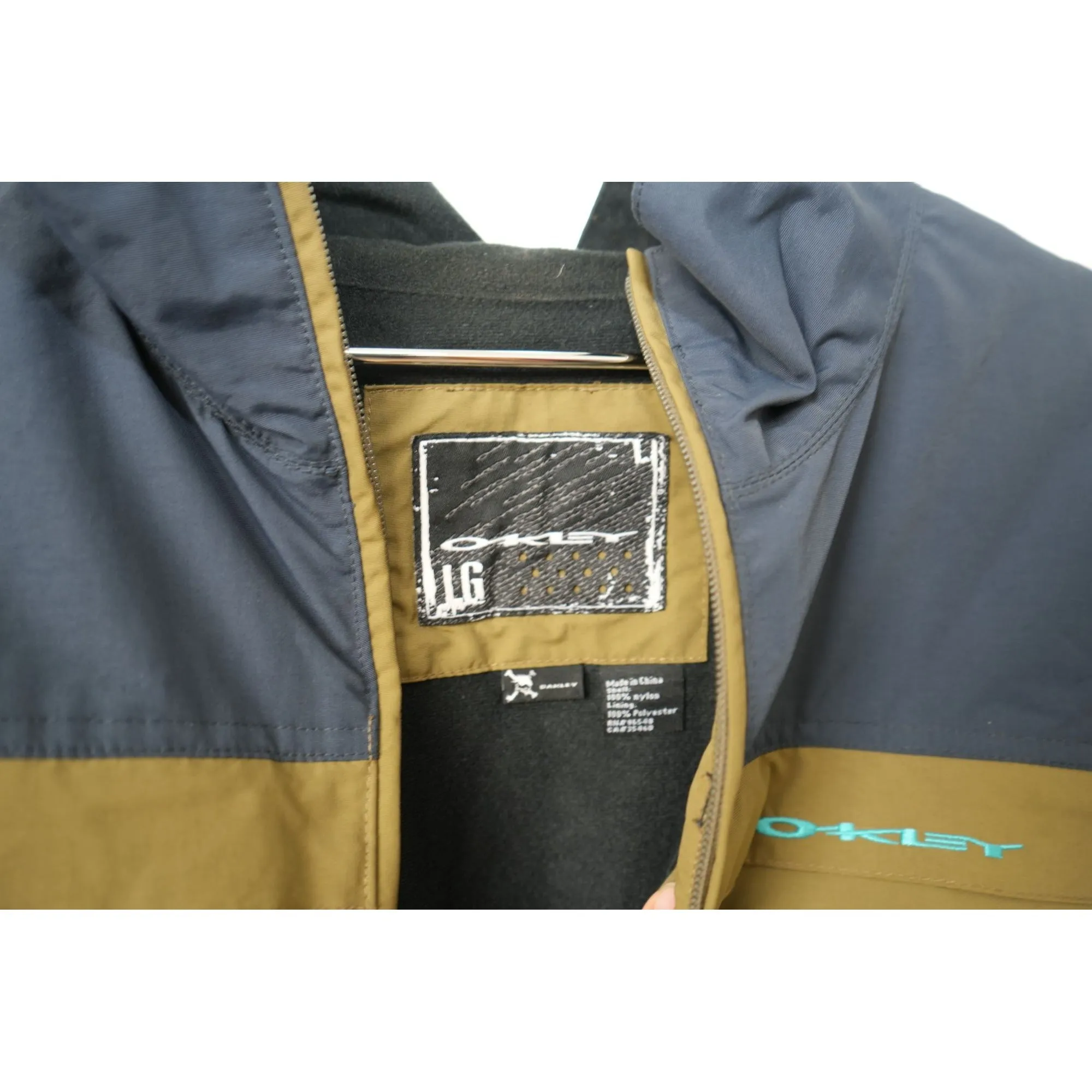 "Retail" Oakley 100% Nylon Full Zip Windbreaker Jacket Navy Blue/Brown Large Men's